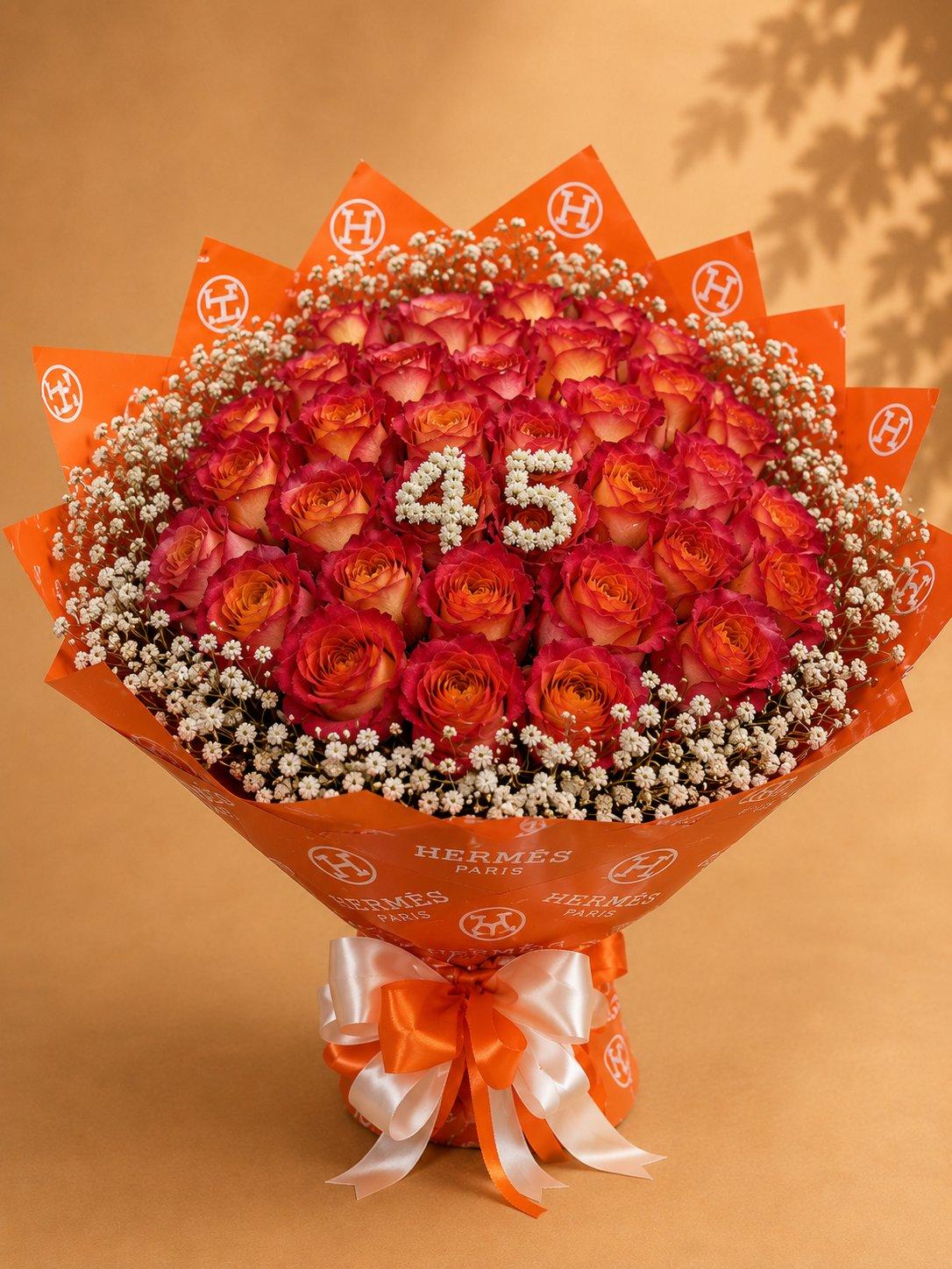 Orange and red rose bouquet celebrating a milestone birthday